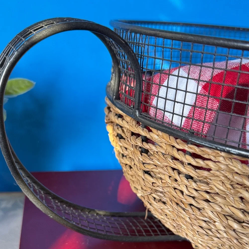 Vintage metal and woven basket designed to look like a large coffee cup.